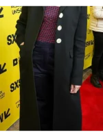 Jenny Slate in a black long coat with button details, showing a timeless and graceful look at the SXSW event.