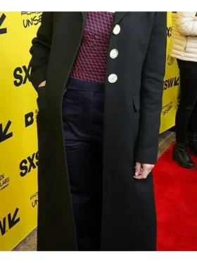Jenny Slate in a black long coat with button details, showing a timeless and graceful look at the SXSW event.