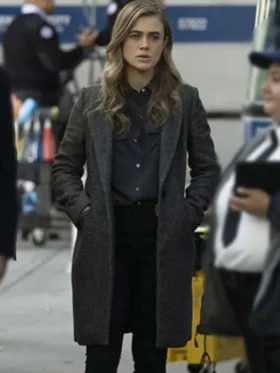 Michaela Stone Grey Coat shown in a casual outdoor scene, highlighting her sophisticated and minimal style