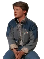 Michael J. Fox as Marty McFly wearing two-tone denim jacket over plaid shirt in Back to the Future movie still