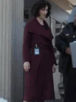 Amelia Salazar from The Recruit 2022 wearing a classy maroon coat with a belted waist and soft collar style