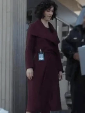 Amelia Salazar from The Recruit 2022 wearing a classy maroon coat with a belted waist and soft collar style