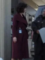 Stylish maroon belted coat inspired by Amelia Salazar from The Recruit series, perfect for an elegant winter look.