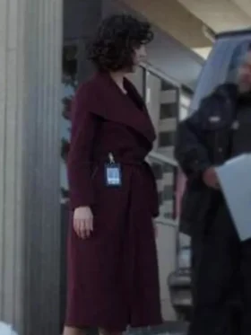 Stylish maroon belted coat inspired by Amelia Salazar from The Recruit series, perfect for an elegant winter look.