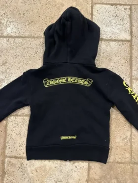 Chrome Hearts Kids Yellow Zip-up Black Hoodie back view highlighting the iconic yellow plus cross motifs and scroll branding.