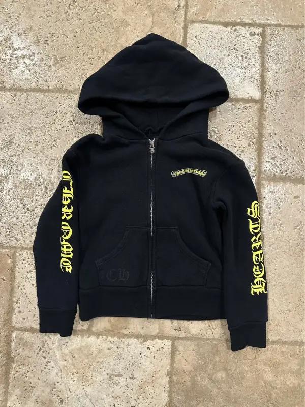 Chrome Hearts Kids Yellow Zip-up Black Hoodie featuring vibrant yellow graphic accents and a premium heavy-weight cotton finish.