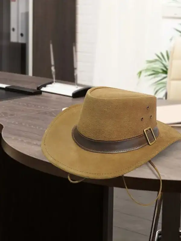 1923 Spencer Dutton brown suede safari fedora with leather buckle band resting on wooden desk lifestyle product shot