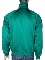 Detailed view of the green and beige jacket fabric, stitching, and stand-up collar.