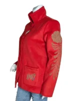 Close-up of the shirt-style collar and button-down front of the Evelyn Wang red punk jacket.