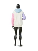 Rear full body view of a black mannequin displaying a pastel color-blocked hoodie with an off-white back, blue hood, pink right arm, and purple left arm.