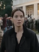 A woman standing outdoors wearing a durable cotton utility jacket with a classic turn-down collar.