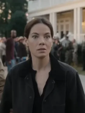 A woman standing outdoors wearing a durable cotton utility jacket with a classic turn-down collar.