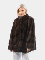 Luxurious faux fur coat for women with a high stand-up collar.