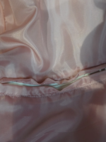 North Face Puffer Jacket Pink pocket detail featuring a secure zipper closure and reinforced stitching.