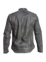 Close-up of a genuine leather racer jacket showing zip-style closure and chest pockets.