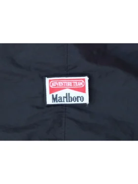 Close-up of the Adventure Team and Marlboro patches on the Ferrari F1 Michael Schumacher jacket.