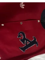 New Arsenal Varsity Jacket for men featuring a premium scarlet and cream colorway with a high-status athletic silhouette.