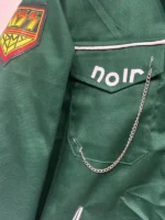 close-up of a black velvet Vince Noir jacket featuring a voluminous black faux-fur collar and cuffs.