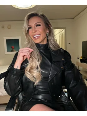 Sleek fitted leather biker jacket featuring zippered cuffs and pockets.