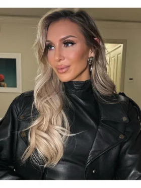 Professional athlete wearing a premium biker-style outerwear piece with a tailored fit and metallic hardware details.