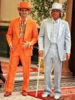 Jim Carrey as Lloyd Christmas in orange tuxedo and Jeff Daniels as Harry Dunne in grey suit from Dumb and Dumber 1994