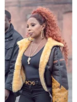 Women's real leather jacket featuring a plush shearling lining and stand-up collar.