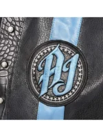 Professional wrestler's sleeveless leather vest featuring a vertical stripe and circular logo patch on the chest.