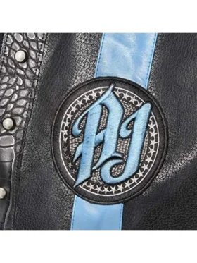 Professional wrestler's sleeveless leather vest featuring a vertical stripe and circular logo patch on the chest.