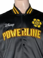 Front and back view of a black satin Disney Powerline Tour Bomber Jacket featuring yellow "Powerline" embroidery on the front and a large "Stand Out World Tour '95" graphic on the back.