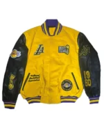 A detail shot of the matte black snap buttons and the rib-knit collar of a black Pro Standard Los Angeles Lakers jacket