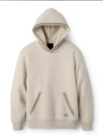 Front of the beige UGG hoodie with the colorful braided trim on the pocket.