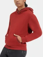 Front of the red UGG Tasman hoodie with braided trim.
