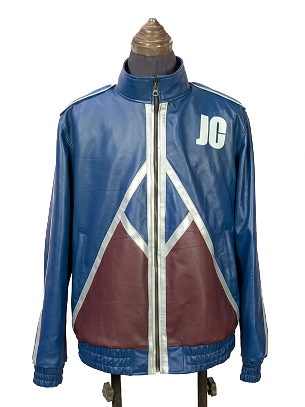 Straight-on front view of the blue Mortal Kombat II Johnny Cage jacket worn by Karl Urban, showcasing the white "JC" emblem and maroon triangular patterns across the waist.