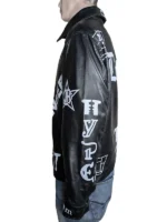 A low-angle shot of Vanilla Ice performing, wearing a variant of the Cool as Ice jacket with metallic silver accents reflecting the stage lights.