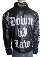 Johnny Van Owen leaning on a sportbike, the "Cool as Ice" jacket draped open to reveal a neon-colored tank top underneath.