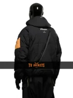 Back view of Death Stranding 2 black jacket showing hood placement, smooth fabric texture, and everyday wearable fit.