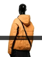Back side view of Death Stranding 2 orange jacket showing hooded design and strong game-inspired color tone.