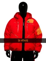 Front view of Death Stranding 2 red jacket featuring hooded collar, zip closure, and bold modern DS2 style.