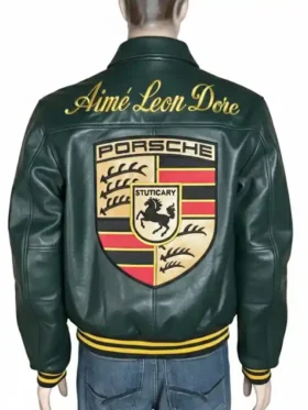 Rear view of the dark green Aimé Leon Dore × Porsche 993 leather jacket on a mannequin. Features a prominent embroidered gold cursive 'Aimé Leon Dore' script across the upper back shoulders and a massive embroidered Porsche Stuttgart coat of arms shield patch filling the center back.