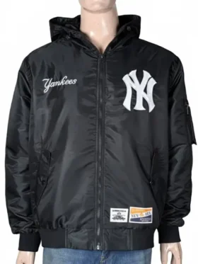 A man’s black New York Yankees x Alpha Industries x New Era bomber jacket featuring a hooded collar and white NY logo.