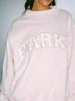 Front view of a Valentines Day Varsity Mockneck Sweatshirt with heart details.