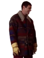 Jim Carrey as Lloyd Christmas laughing in multicolor Western cowboy jacket with gloves from Dumb and Dumber 1994