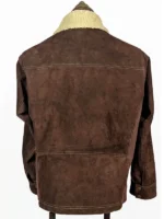 Close-up of a suede leather jacket showing the zipper closure and soft shearling neck detail.