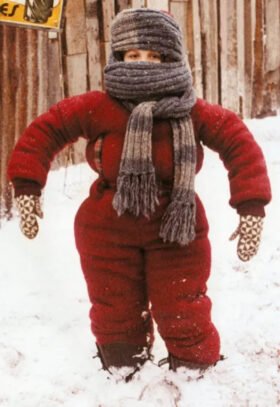 A Christmas Story snow suit costume with Randy almost completely bundled up and struggling to move.