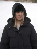 Alexandra Breckenridge long black puffer coat in My Secret Santa winter movie scene.