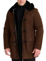 Warm brown shearling sheepskin trench coat mens, durable leather coat with black trim and patch pockets.