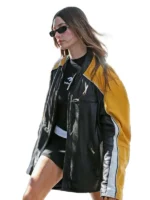 Close-up of Hailey Bieber cropped yellow leather jacket, a celebrity inspired statement piece.