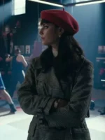 Kaya Scodelario wearing a fashionable checked long coat or wool plaid coat while observing a scene in a fighting gym.