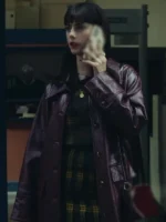 Close-up of Kaya Scodelario trench leather coat The Gentlemen in deep red/purple. Part of the iconic Susie Glass The Gentlemen 2024 leather outfit.