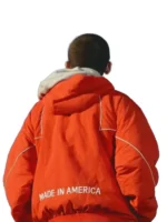 Back view of the orange Marty Supreme jacket with white piping.